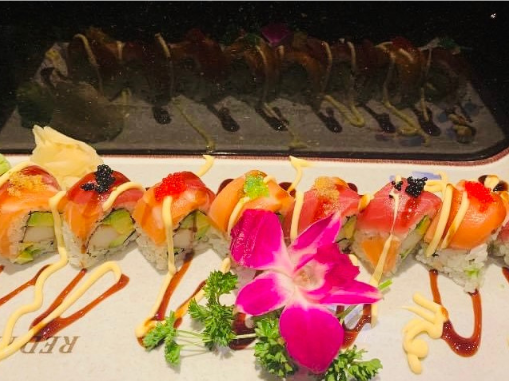 Sushi rolls with salmon, tuna and toppings, served with sauces at Red Mango Asian Cuisine Restaurant in Stratham