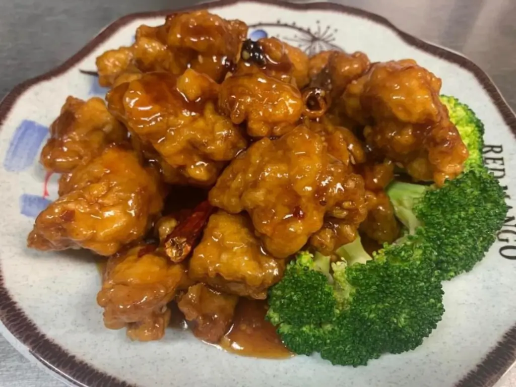 Crispy chicken in spicy sauce, served with broccoli at Red Mango Asian Cuisine Restaurant in Stratham