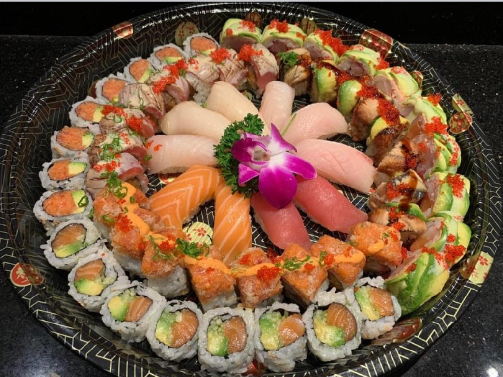 Assorted sushi rolls and sashimi with tobiko topping at Red Mango Asian Cuisine Restaurant in Stratham