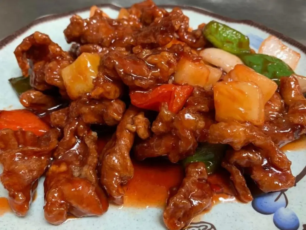 Crispy pork tossed in sweet and sour sauce with pineapple at Red Mango Asian Cuisine Restaurant in Stratham