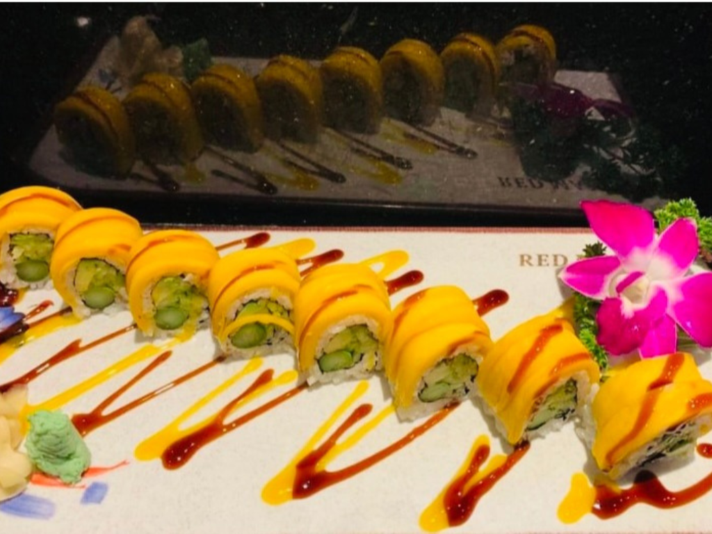 Sushi roll wrapped in fresh mango, drizzled with sauces at Red Mango Asian Cuisine Restaurant in Stratham